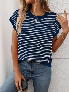 Detail of navy and white striped knit top showing round neck and textured fabric
