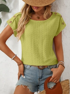 Detail of green hollow-out embroidered T-shirt with vintage shoulder buttons