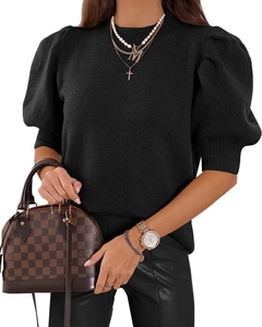Detailed close-up of a women's black puff sleeve knit top with a neat round neckline