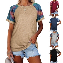 Detail of V-neck summer T-shirt with abstract star print on raglan short sleeves