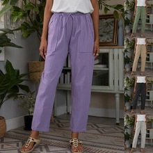 Detail of high-waist loose trousers showing various colors and convenient drawstring waist