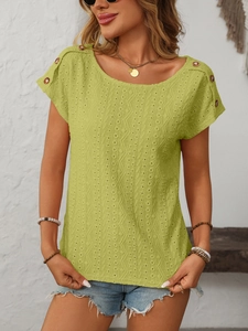 Detailed view of lime green eyelet knit top featuring decorative buttons on the shoulder
