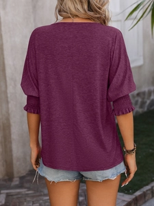 Back view of magenta V-neck T-shirt with elastic ruffled sleeves and central seam detail