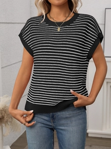 Detailed view of women's short sleeve knit top featuring classic black and white stripes
