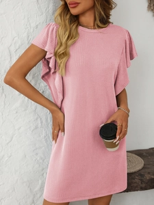 Detail of light pink knit dress showing vertical ribbed texture and layered ruffle sleeves