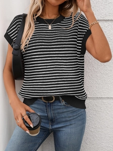 Detail of knit fabric texture and ribbed neckline on black and white striped top
