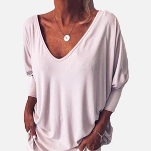 Women's V-neck batwing sleeve loose knit top in light beige with coin necklace
