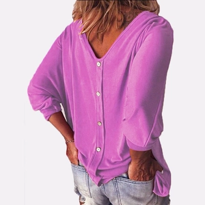 Detail view of the deep V-neck back design with four yellow decorative buttons on a purple top