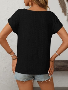Detail view of black eyelet embroidery texture on short sleeve casual bohemian top