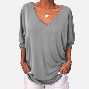 Detailed view of the soft grey knit fabric and relaxed V-neckline of this casual women's top