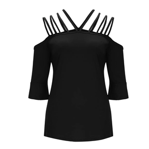 Detail of off-shoulder black top with crisscross straps and bell sleeve design