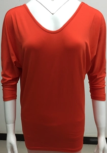 Detailed front view of bright orange batwing sleeve top with crew neck on mannequin