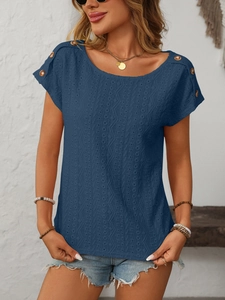 Detail of navy blue hollow knit fabric with decorative wooden buttons on shoulders