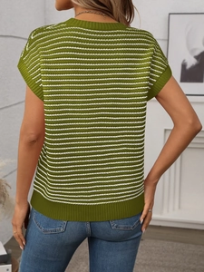 Rear view of green and white striped knit top paired with jeans in home setting
