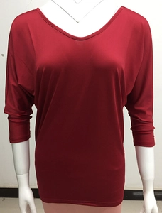 Front view of bright red blouse featuring casual batwing sleeves and wide neckline