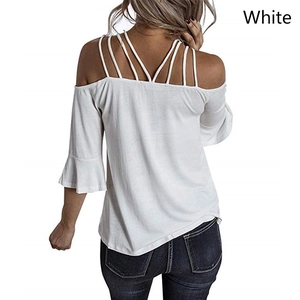 Back view of white off-shoulder top with criss-cross straps and elegant bell sleeves