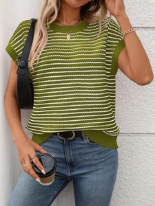 Detail of green and white striped knit top showing ribbed crew neck and textured fabric