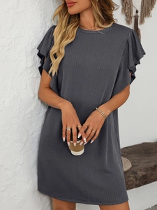 Detail of dark grey ribbed knit dress featuring layered ruffle sleeves and crew neckline