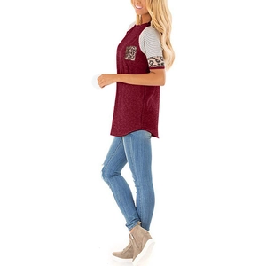 Detail of color-block T-shirt with leopard print pocket and striped patchwork sleeves