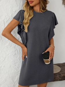 Detail of grey ribbed knit midi dress with ruffle cap sleeves in a lifestyle studio setting