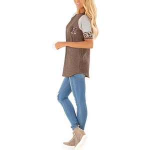 Detailed side view of women's patchwork t-shirt with leopard pocket and striped sleeves