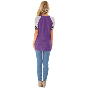 Detail of t-shirt sleeve with black white stripes and leopard print patchwork on purple top