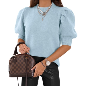 Women's light blue knit short sleeve sweater with puff sleeves and crew neck design