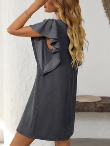 Detail view of charcoal grey pleated dress featuring layered ruffle cap sleeve design