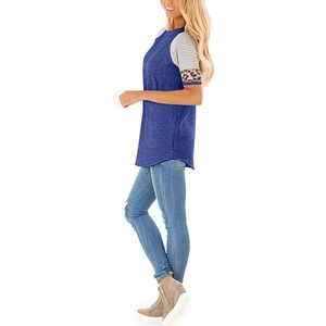 Side view of royal blue T-shirt featuring striped and leopard print patchwork sleeves