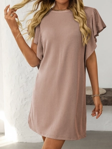 Detailed texture of dusty pink ribbed knit dress with elegant ruffle sleeves and round neck