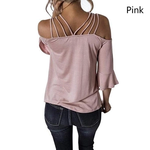 Detail of pink off-shoulder top featuring strappy back design and flared bell sleeves