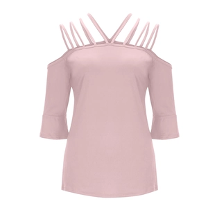 Detail of pink off-shoulder top featuring criss-cross straps and ruffled flare sleeves