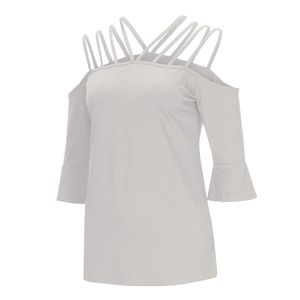 Detail of off-shoulder light grey top featuring cross straps and elegant bell sleeves