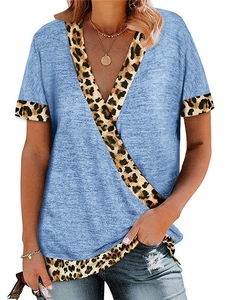 Detail of V-neckline featuring leopard print trim on a light blue short sleeve t-shirt