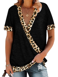 Close-up of deep V-neckline and leopard print patchwork on black short sleeve t-shirt