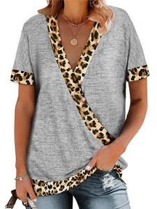 Detail of grey V-neck t-shirt with leopard print patchwork on sleeves and collar