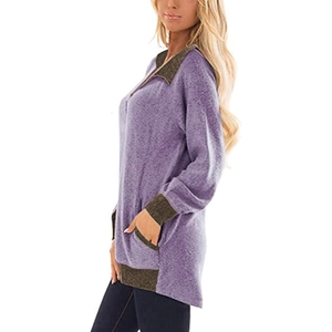 Détail d'un sweat-shirt lilas avec poches latérales et finitions en bord-côte contrastées