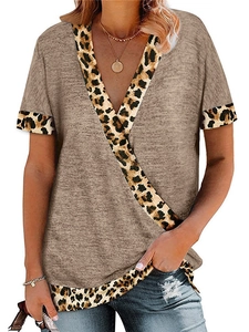 Detail of V-neck stitching with leopard print accents on a grey short sleeve t-shirt