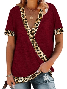 Detail of burgundy V-neck T-shirt with leopard print trim on neckline and short sleeves