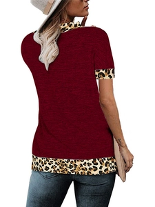 Back view of a deep red short sleeve top featuring leopard print trim and casual style