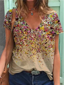 Detailed close-up of V-neck floral print and lightweight gradient fabric on the short sleeve tee