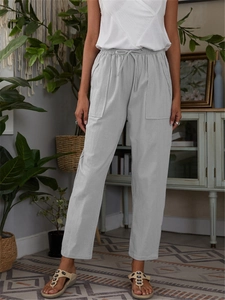 Detail of grey cotton linen casual pants featuring elastic drawstring waist and large pockets