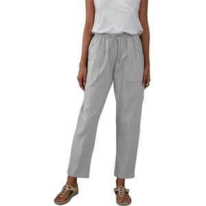 Detailed view of wide square front pockets and elastic drawstring waist on linen pants