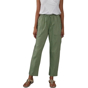 Detail of army green linen pants featuring elastic drawstring waist and large patch pockets