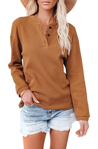 Detail of brown waffle knit Henley top with three buttons and long sleeves for women