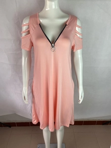 Close-up of coral pink V-neck dress with zipper detail and cold shoulder cut-outs