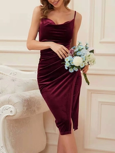 Detail of burgundy velvet dress featuring elegant draped cowl neck and thin spaghetti straps