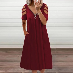 Detail of burgundy V-neck dress with silver zipper, metal ring puller and cold shoulder design
