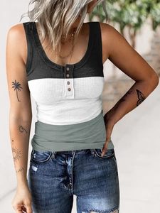 Detailed view of the rib-knit texture and wooden buttons on the tri-color henley vest