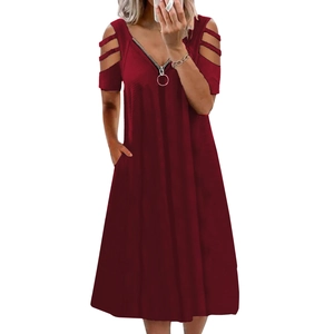 Detail of burgundy V-neck dress featuring a metal zipper pull and cold shoulder cut-outs